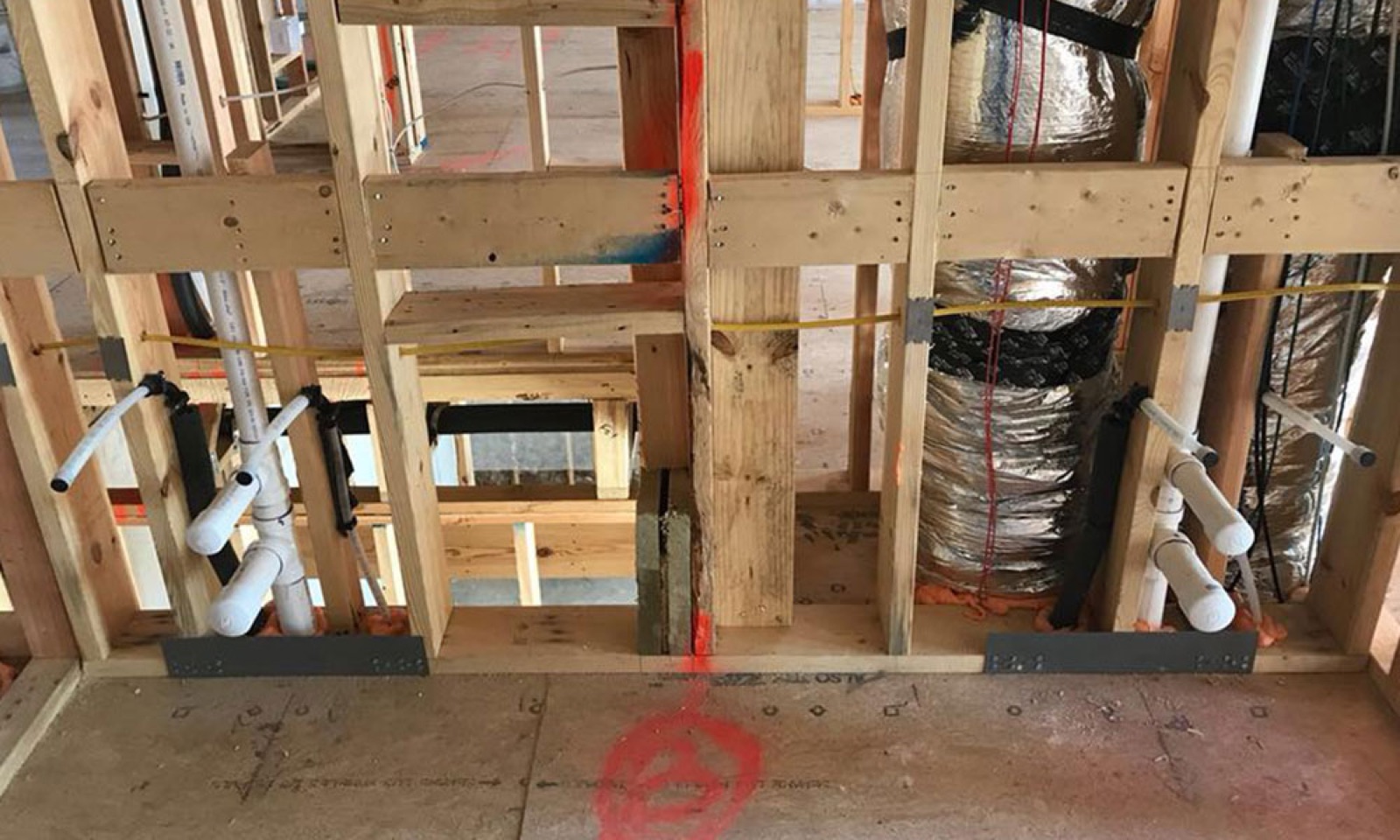 New-construction plumbing rough-in (pipes in wall) in Pflugerville, TX